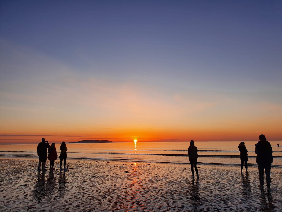 Sunrise at a beach with people