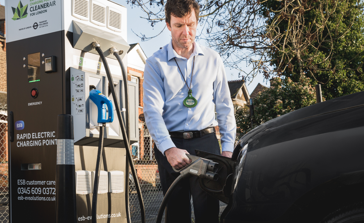 Man charging EV at ESB Energy charger