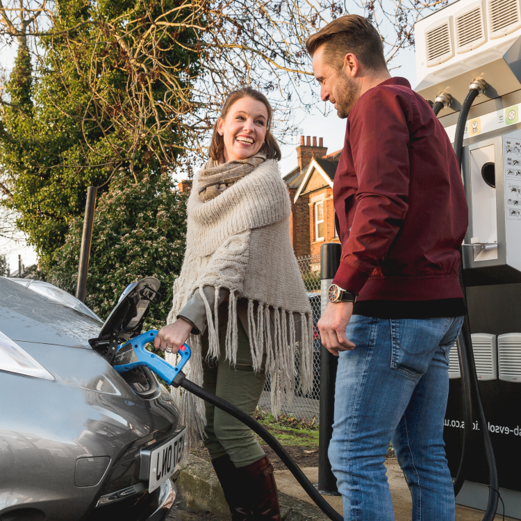 Woman charging EV